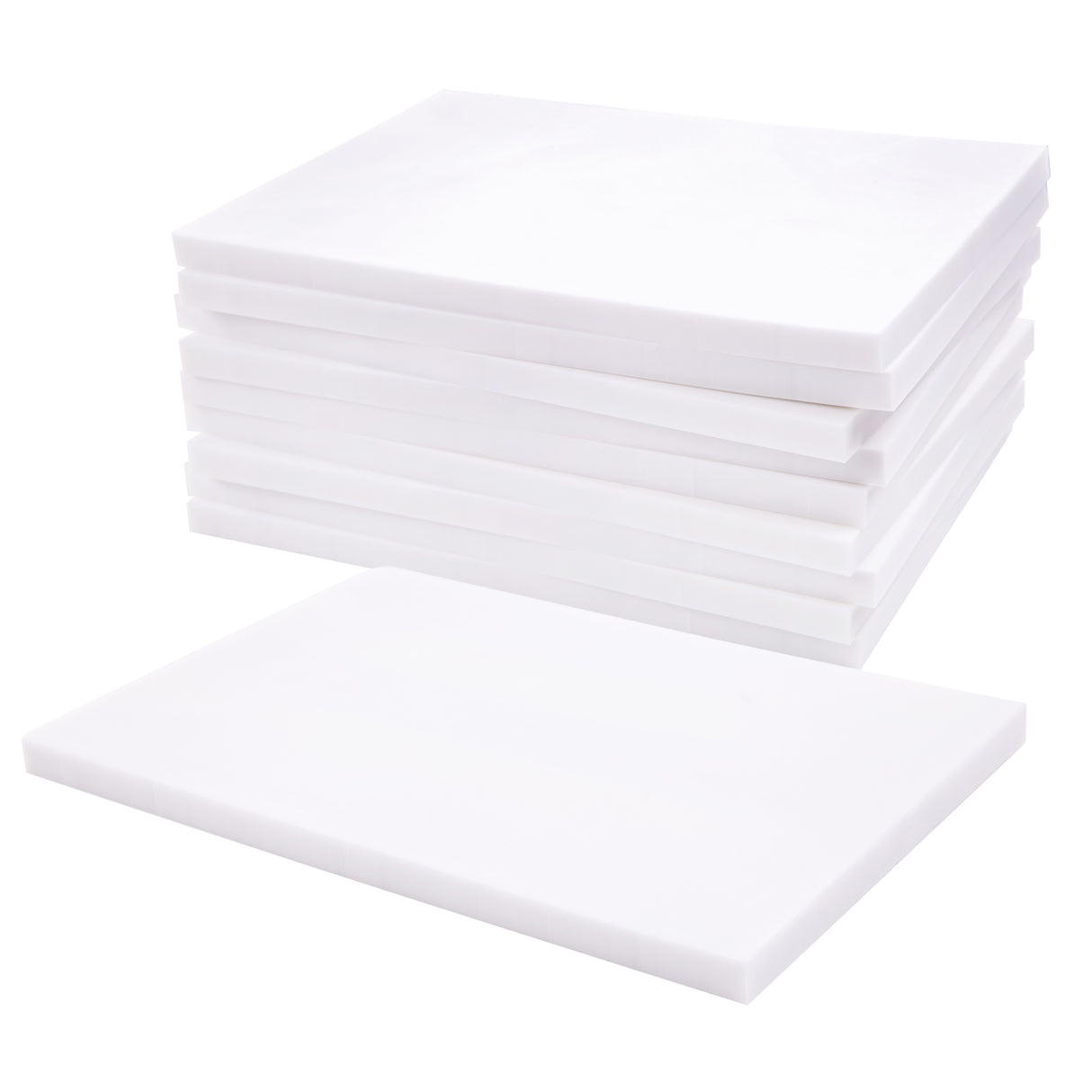 Stack of white soft cut carving blocks arranged in a neat pile, with one block placed flat in front. Each block has straight, clean edges and a smooth matte surface. The uniform thickness is visible along the sides against a white background.