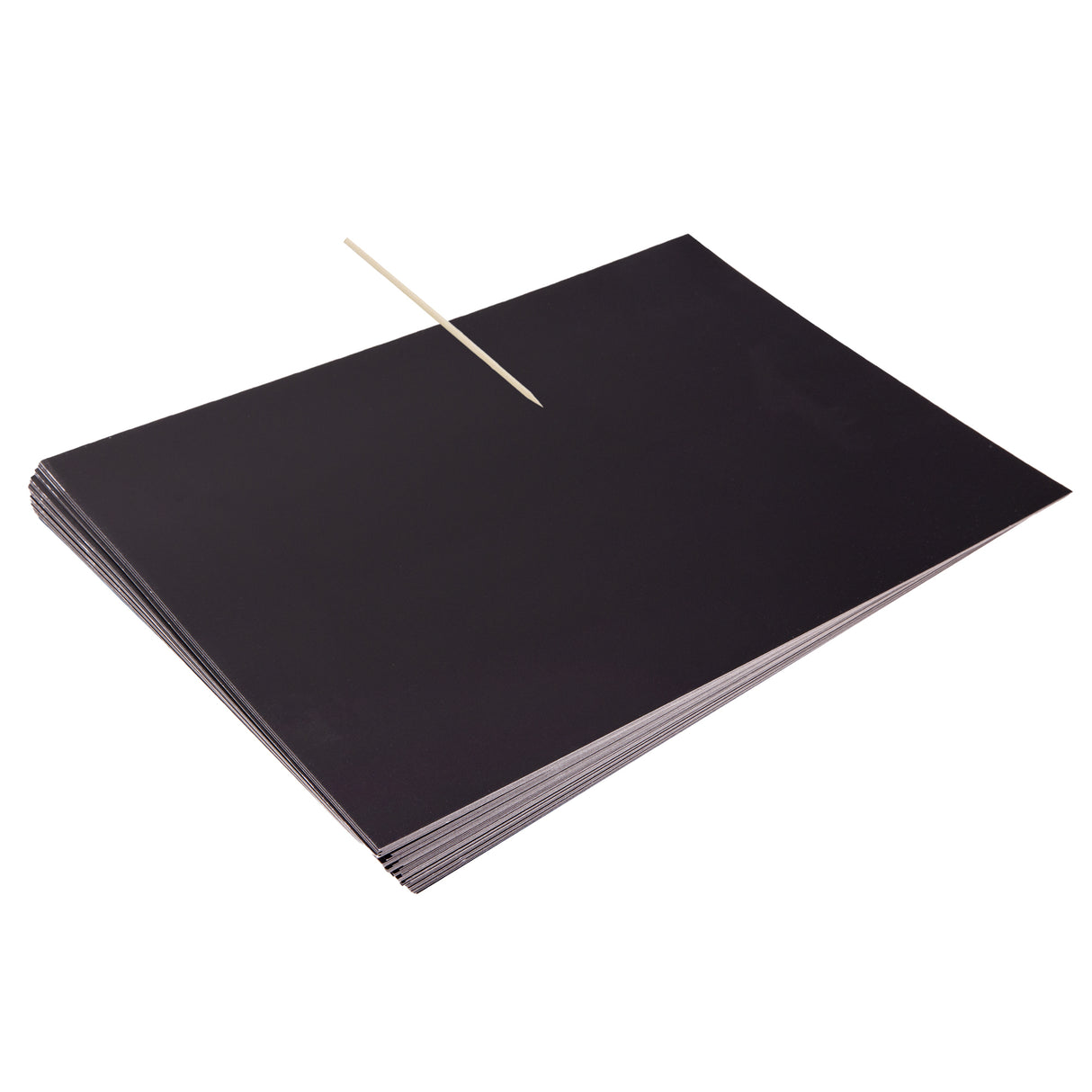 A stack of Zart Scratch Paper sheets in solid black, with a wooden stylus tool resting diagonally across the top sheet. The paper has a smooth, matte black surface, showing no visible texture or markings, ready for scratching designs into the surface.