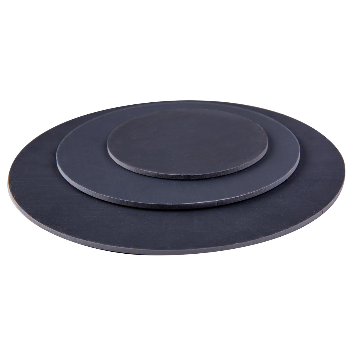 Three Mastercut Print Lino Round blocks shown stacked in graduated sizes on a white background. Each circular block is made from dark grey lino with smooth, flat surfaces and clean-cut edges, designed for carving and printmaking. Minimal product-only studio shot.