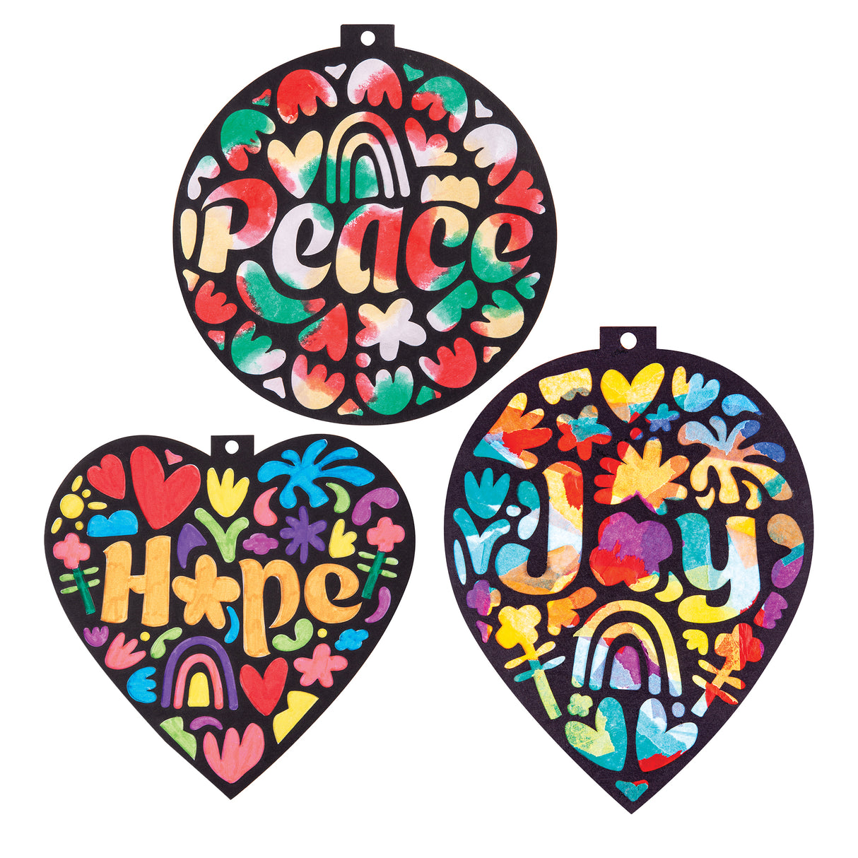 Three decorated samples made using Zart Stained Glass Wellbeing Baubles stencils, backed with colourful tissue paper in red, green, yellow, blue and purple. The "Peace", "Hope" and "Joy" designs glow with a stained-glass effect, showing hearts, rainbows and florals through the black cut-out shapes.