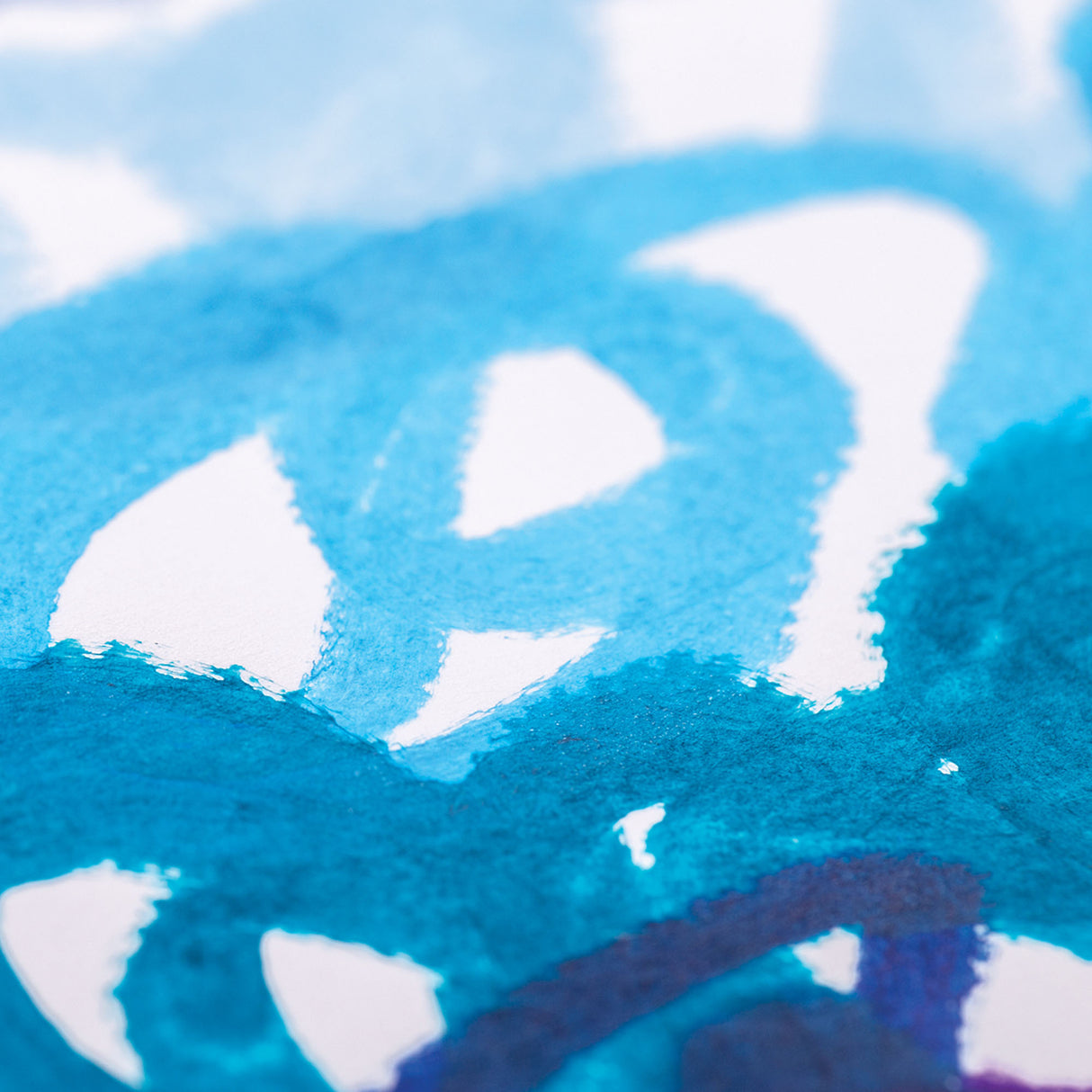 Macro close-up of Cool Ocean Slicks paint applied to paper, showing layered strokes of turquoise and deep blue with a smooth, slightly glossy finish.