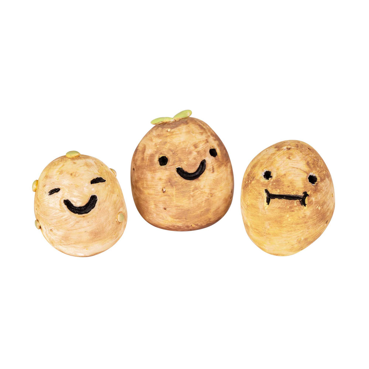Three sculpted potato characters made from Magiclay Potato Clay, each with a different painted expression: a winking smile, a wide-eyed grin and a surprised look. Small green sprout details top two of the figures, showing the clay's natural, earthy finish and sculpting versatility.