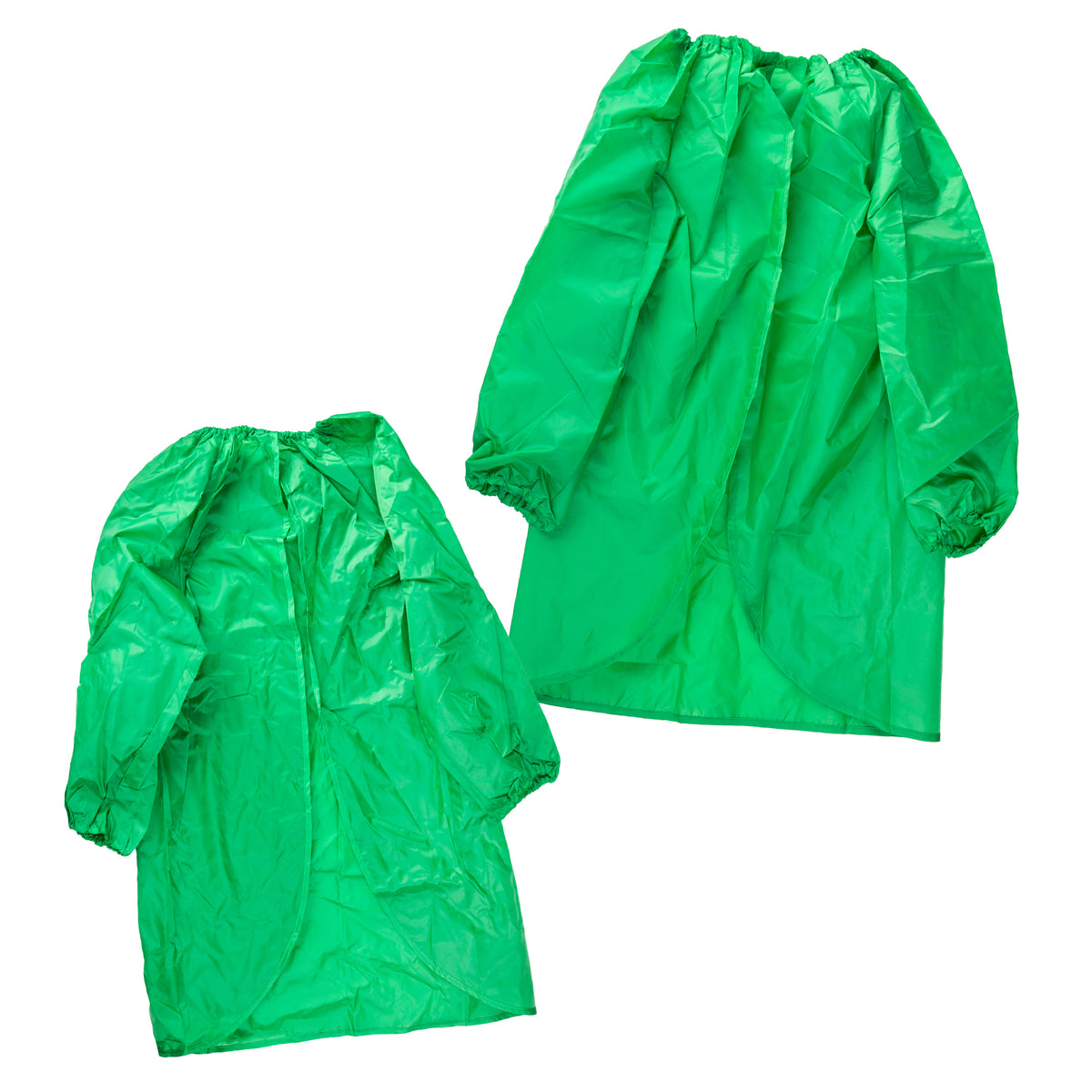 Two green Zart smocks laid out together, a smaller one in front and a larger one behind, showing the size difference between them. Both have an elasticated round neckline gathered into folds, long sleeves with elasticated cuffs, and a curved front hemline.