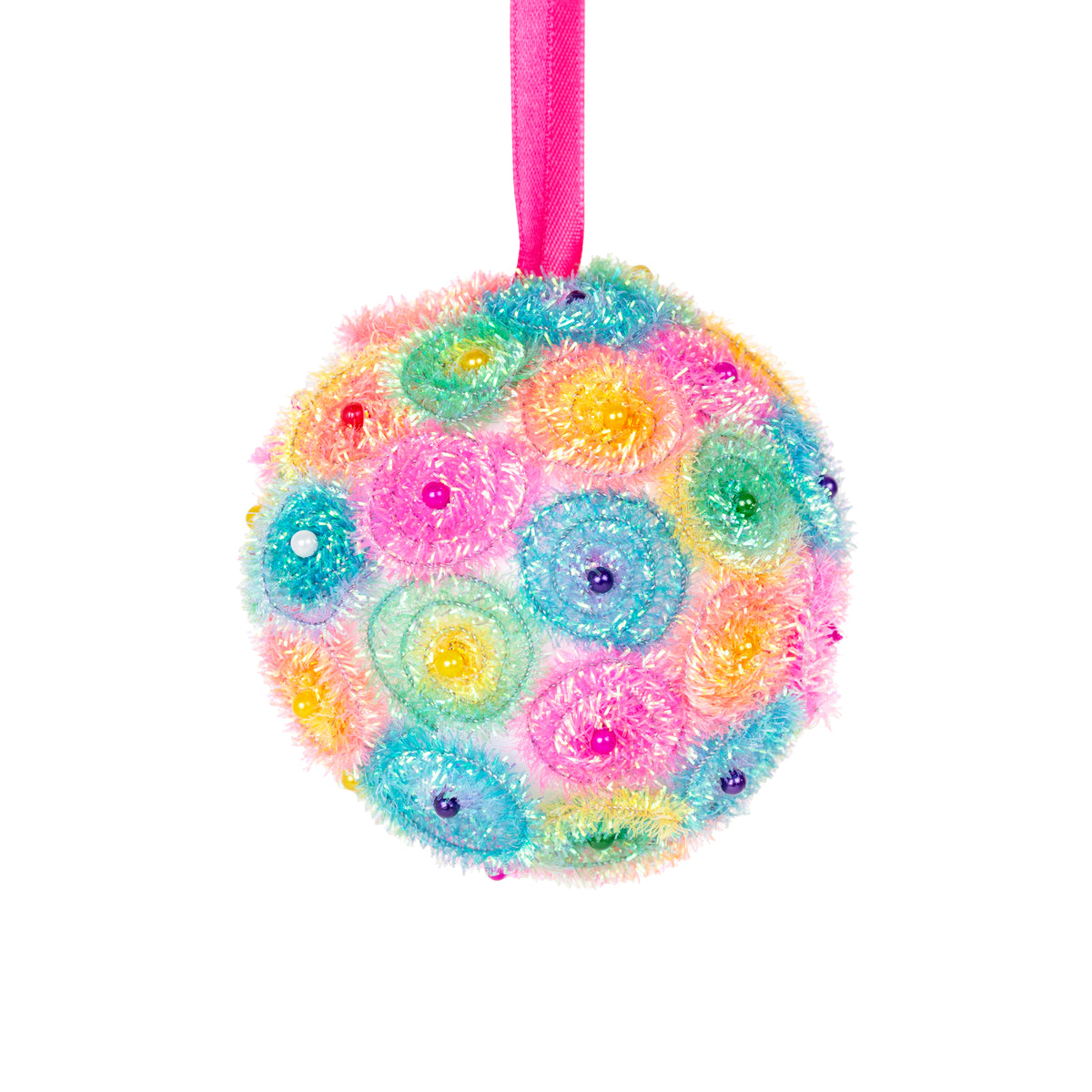 A Zart Poly Deco Foam ball decorated as a hanging bauble, covered in fluffy pastel spirals of pink, blue, green, yellow and orange, dotted with small coloured beads. It hangs from a bright pink ribbon against a white background, showing a decorative craft finish.