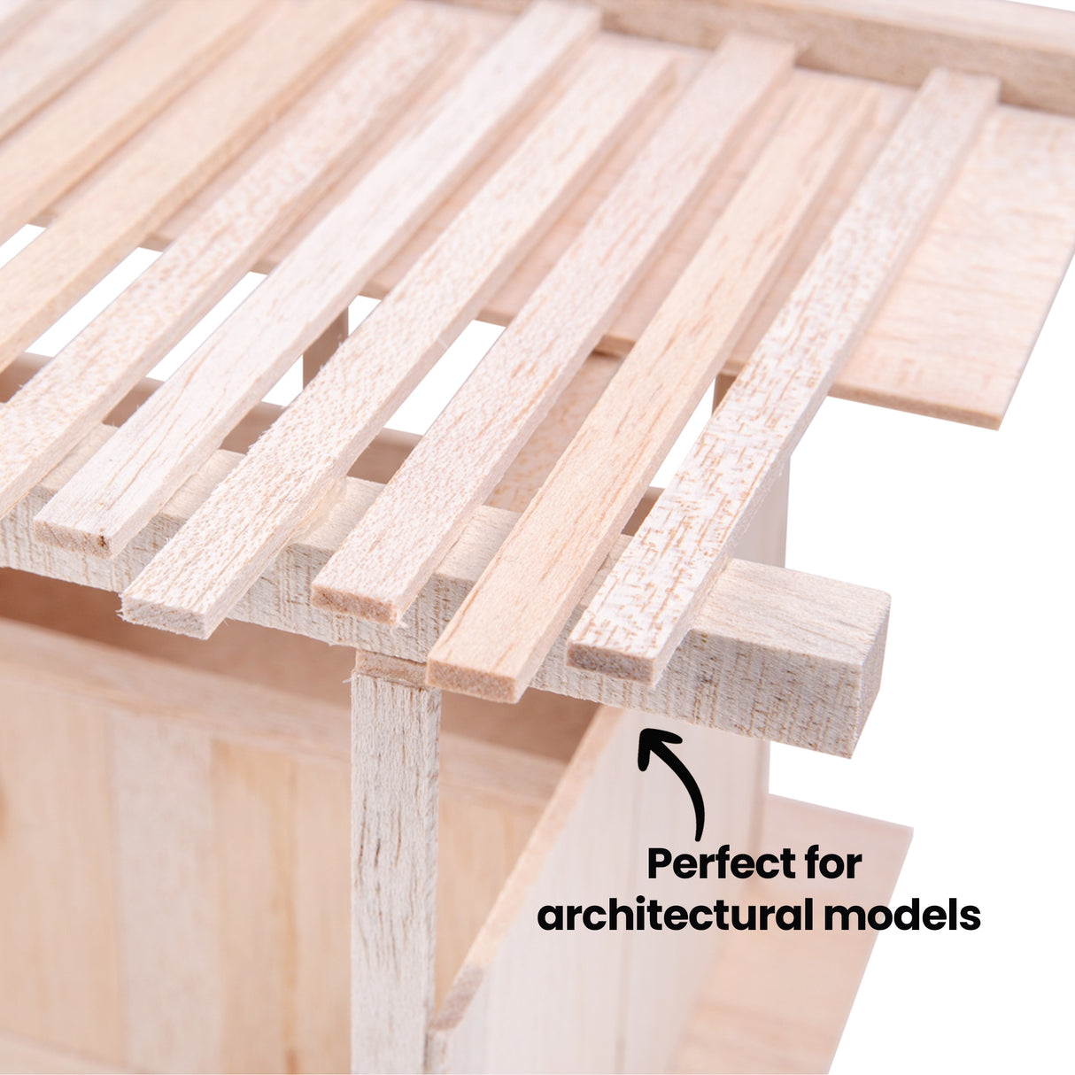 Close-up of balsa wood roof slats arranged in parallel lines. Surface reveals fine grain, subtle tonal variation, and a soft, slightly rough texture typical of balsa. Annotation text reads “Perfect for architectural models” with arrow pointing to the structure.