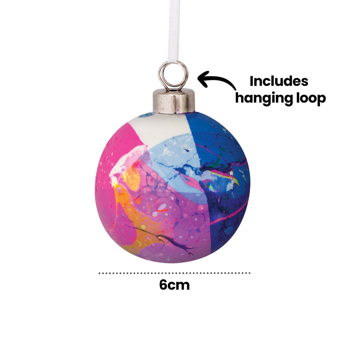 A Zart Ceramic Bauble decorated with a swirling marbled pattern in pink, blue, purple and orange, with white and metallic accents throughout. A silver cap and white ribbon loop top the bauble. Text overlay reads "Includes hanging loop", with a dimension line marking 6cm.