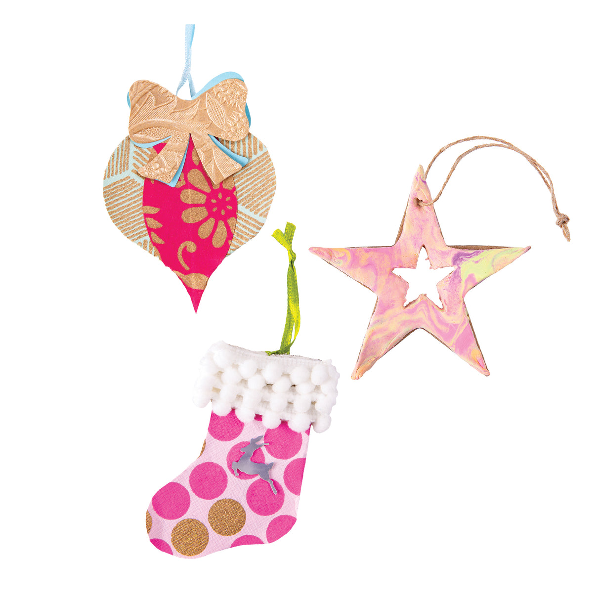 Three decorated Zart Papier-mache Christmas ornaments, including a pink and gold floral bauble with a textured bow, a marbled pink and yellow star on jute string, and a polka-dot stocking trimmed with white pompoms and a small reindeer charm.