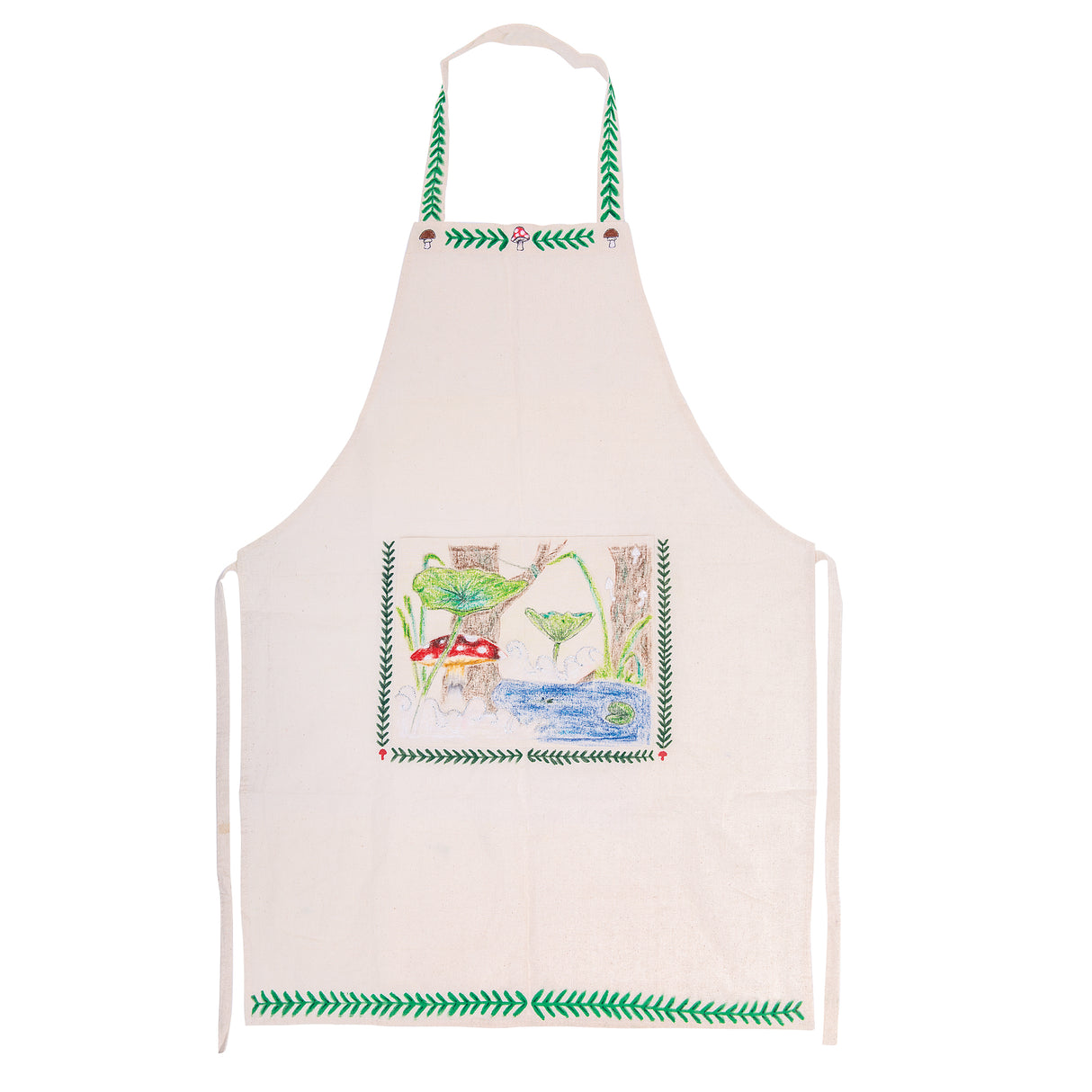 A Zart Calico Apron decorated with a woodland scene showing red-and-white spotted toadstools, tall green grass, and a blue pond beneath large green leaves and tree trunks. A green leaf-vine pattern borders the neck strap, pocket panel, and hem, with small brown and red mushroom motifs along the neckline.