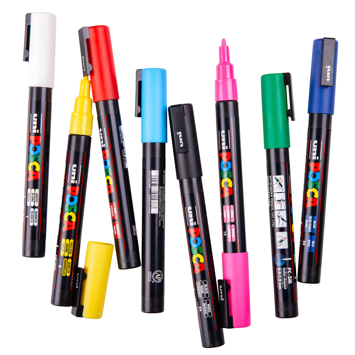 Assorted POSCA paint markers scattered on a white background, with some markers uncapped to show their fine bullet tips in bright colours such as yellow, pink, and blue.