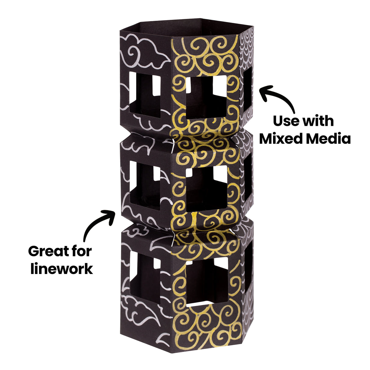 A stacked geometric paper structure decorated with flowing white and metallic gold linework is shown against a neutral background. Black annotation text reads “Great for linework” and “Use with Mixed Media,” highlighting the crisp, opaque marker details.