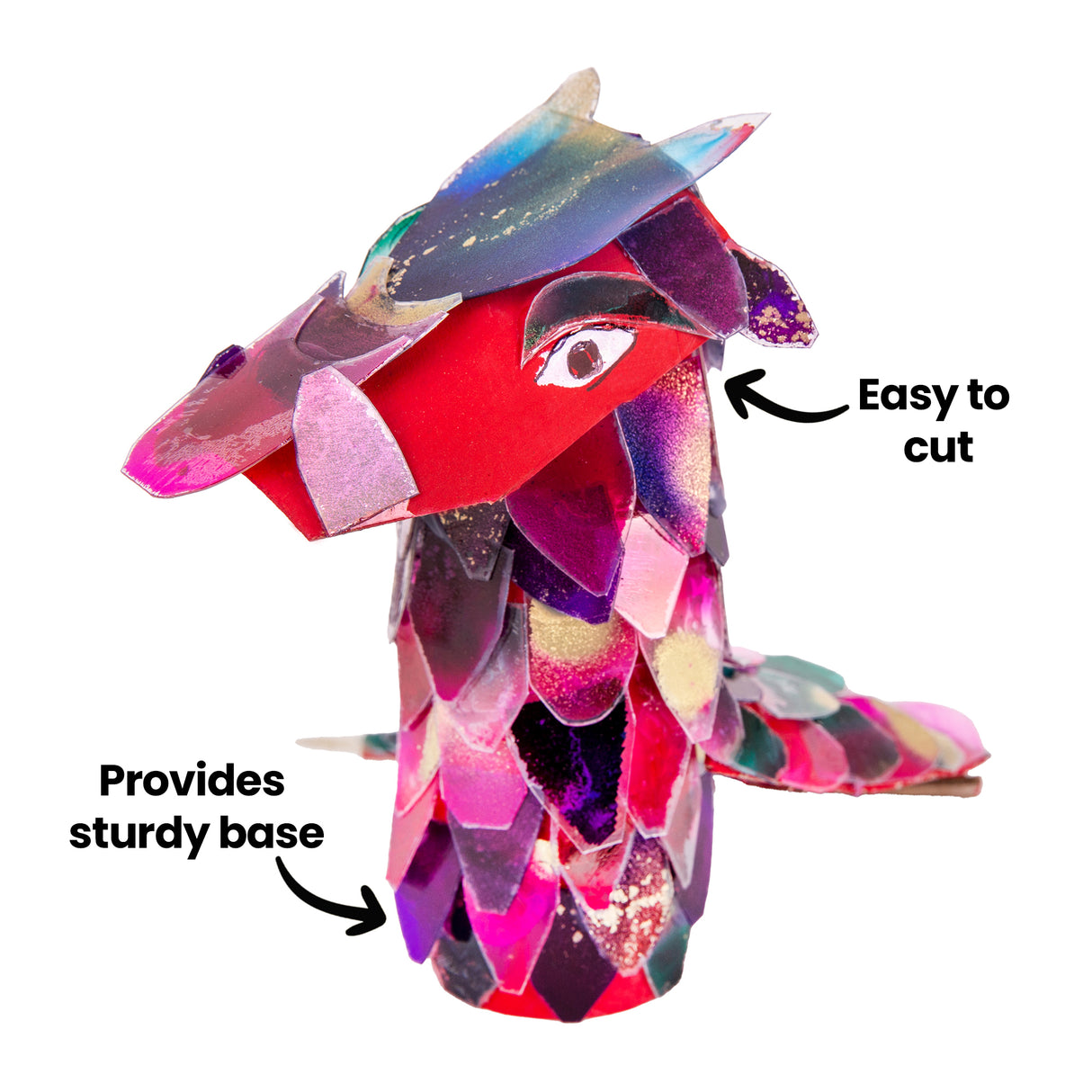 A colourful mixed media animal sculpture made from a papier-mache tube is displayed against a pale background. Iridescent overlapping paper pieces cover the tube base, while black annotation text reads “Provides sturdy base” and “Easy to cut”, highlighting creative construction features.