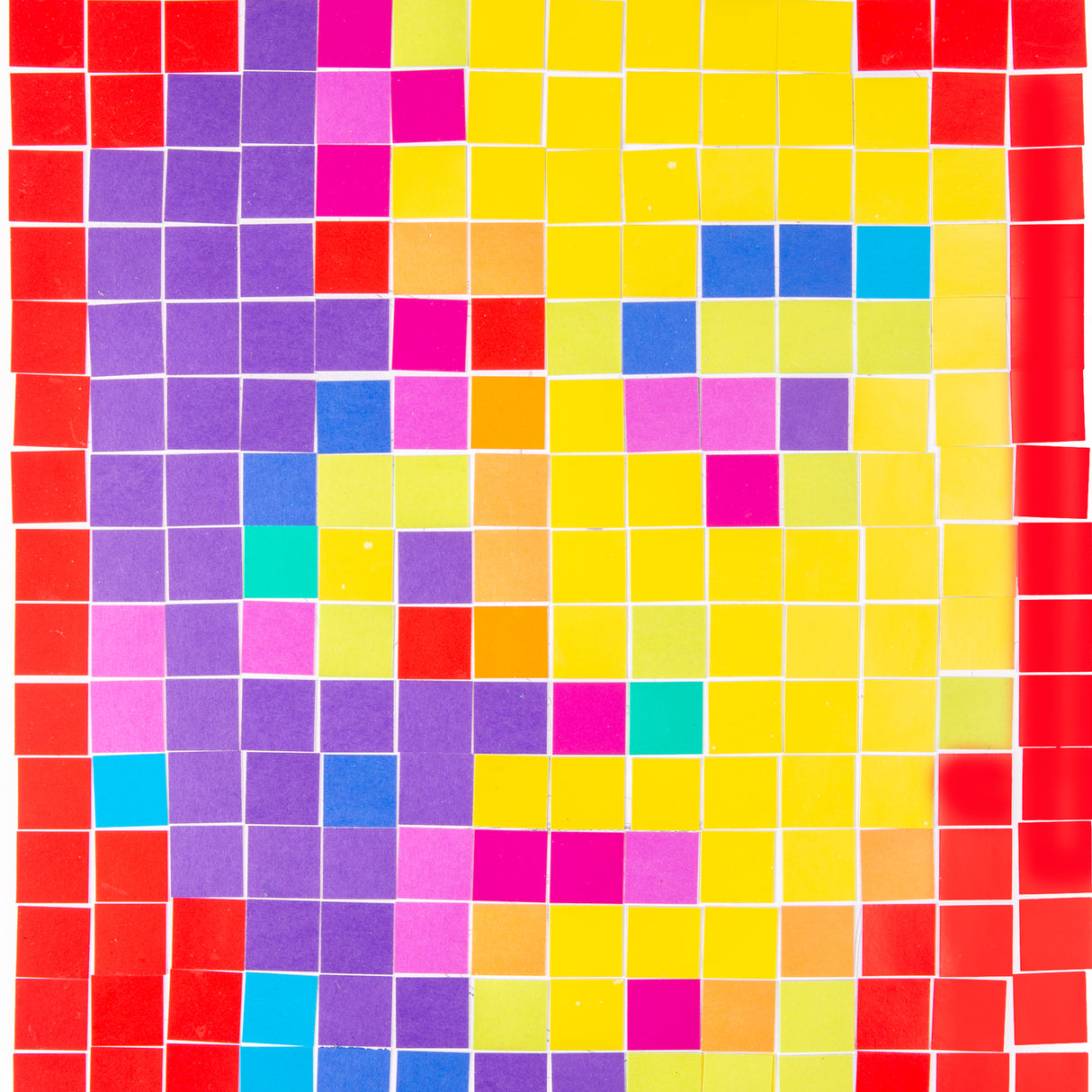 A close-up of a mosaic worked in Cardboard Mosaic Squares 2cm Pack of 4000, showing the tiles laid in a grid with small white gaps between them. Colours include red, purple, yellow, pink, blue and orange, highlighting the individual square format and matte surface.