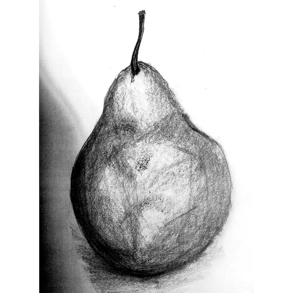 A charcoal drawing of a single pear with a prominent stem, rendered in rich tonal shading from deep blacks to soft pale greys. Smooth blended gradients model the rounded form, with a cast shadow beneath, showing the velvety range of natural willow charcoal.