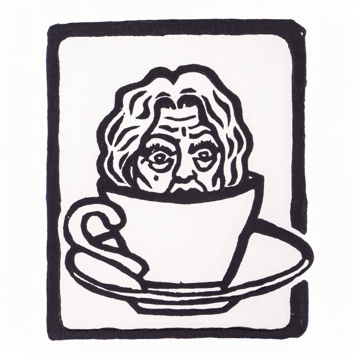 Black and white lino print of an older person’s face emerging from inside a teacup resting on a saucer. Strong outlines and simplified shapes showcase the expressive, high-contrast results achieved using Silk Cut Lino Tile.