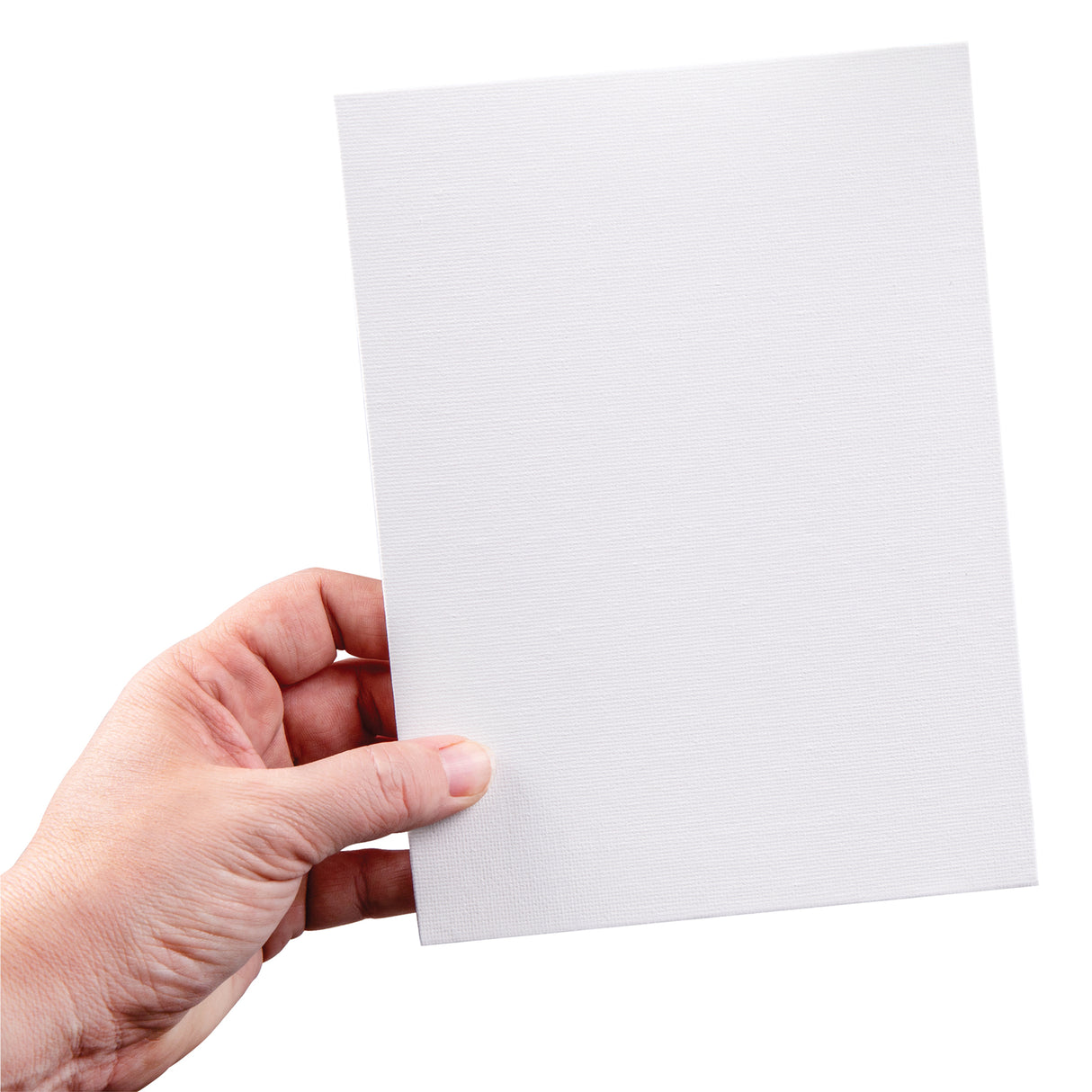 A hand holds a small rectangular canvas board against a light background. The white primed canvas surface shows a subtle woven texture across the board, with clean straight edges and a rigid backing.