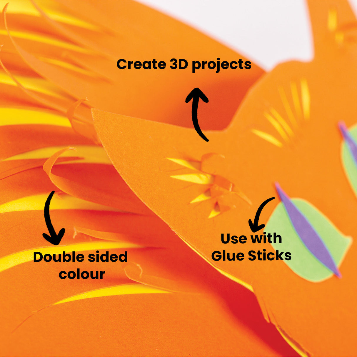 Vibrant orange and yellow cardboard sheets arranged in overlapping layers showing dimensional curved forms. Text annotations read Create 3D projects, Double sided colour, and Use with Glue Sticks. A small rainbow gradient colour swatch appears in the corner demonstrating the available colour range in this cardboard pack.