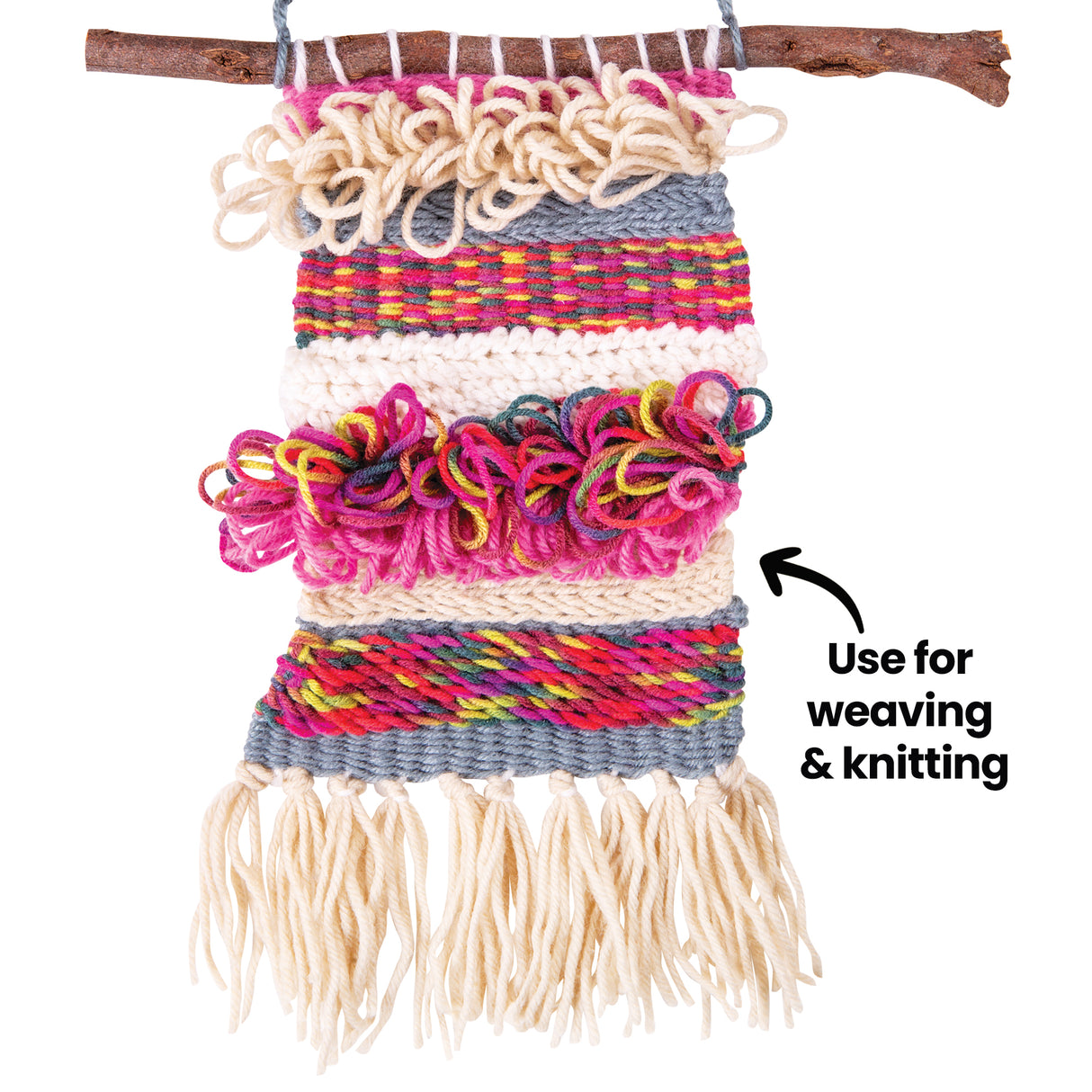 Textured woven wall hanging made from layered yarn in pink, cream, grey and multicolour strands. The piece features loops, knots and dense weaving, suspended from a natural stick. Annotation text reads “Use for weaving & knitting”.