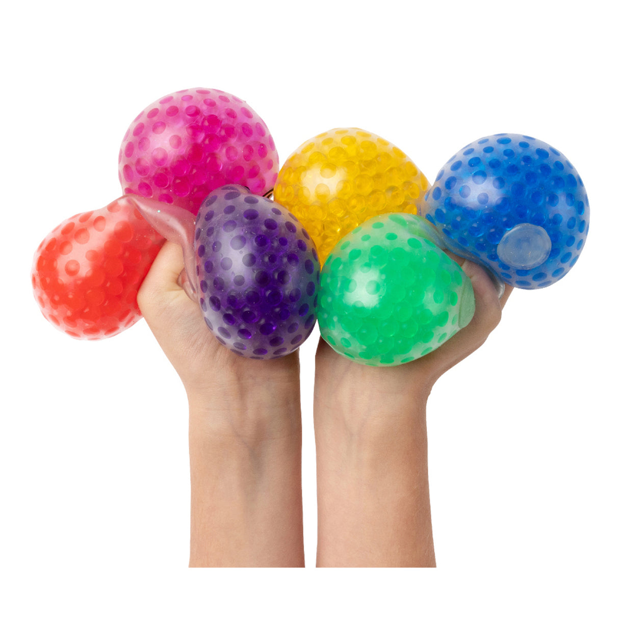 Two hands holding six colourful squishy sensory balls filled with gel beads. The transparent EmotiBalls feature pink, orange, purple, yellow, green and blue colours with visible textured beads inside creating a tactile, squeezable surface for sensory play and stress relief activities.