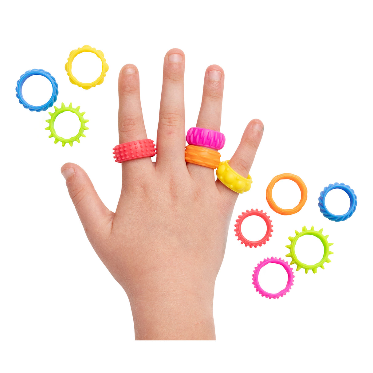 Child's hand wearing four colourful textured fidget rings in red, pink, orange and yellow on different fingers, surrounded by eight additional rings in blue, green, pink, orange and coral featuring varied tactile surfaces including smooth bands and spiky gear-like edges from the Sensory Sprouts Textured Fidget Rings set.
