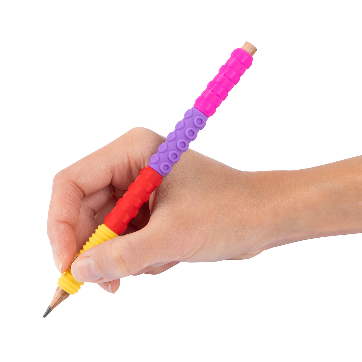 Child's hand holding a pencil fitted with colourful stacking textured pencil grips in bright pink, purple, red and yellow sections. Each grip features different tactile patterns including bumps and ridges, designed to provide sensory feedback and improve pencil control for young learners.