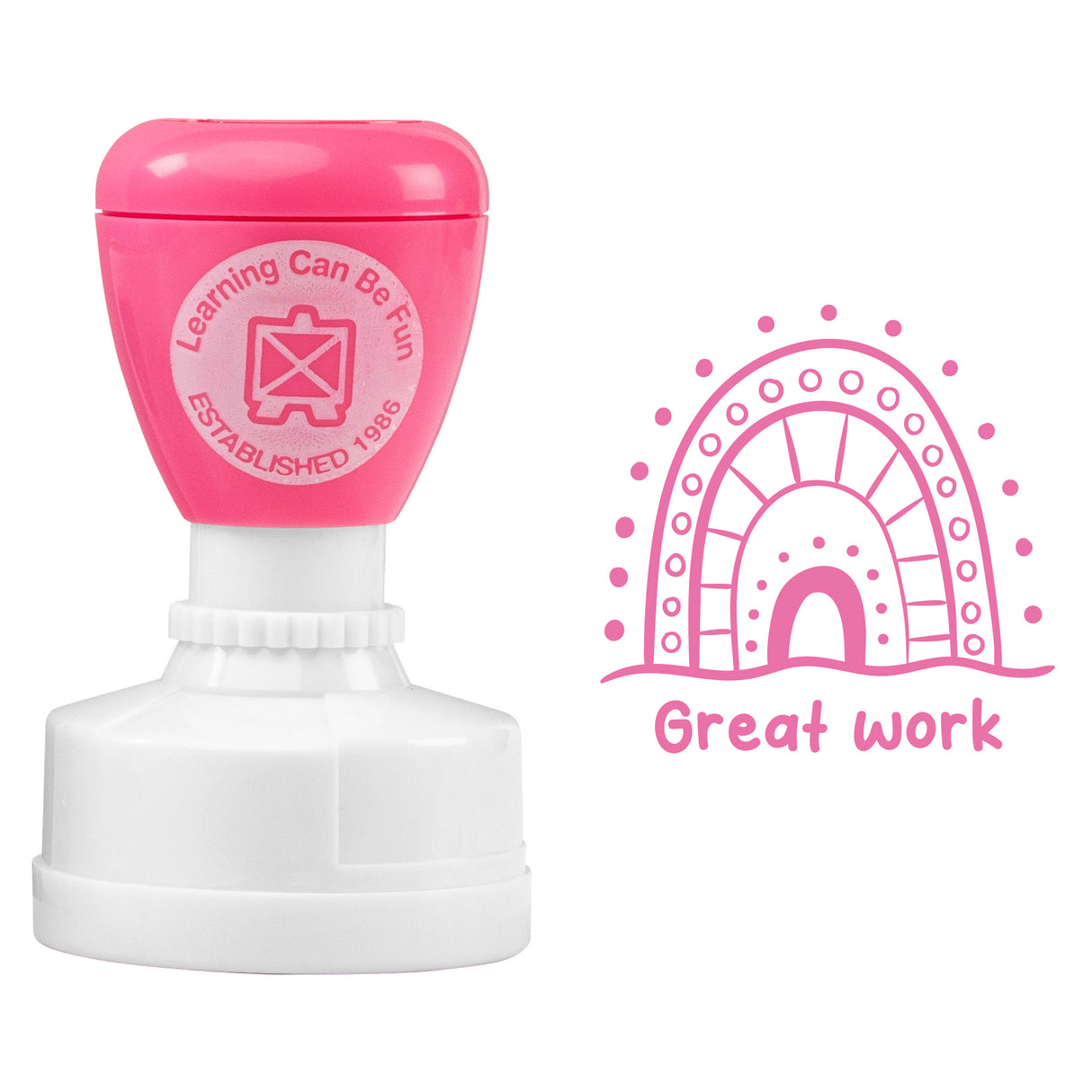 Self-inking Merit Stamp with bright pink top and white base featuring circular logo reading "Learning Can Be Fun ESTABLISHED 1985". Stamp impression shows decorative rainbow design with dots and patterns in pink, accompanied by text "Great work" in casual lettering.