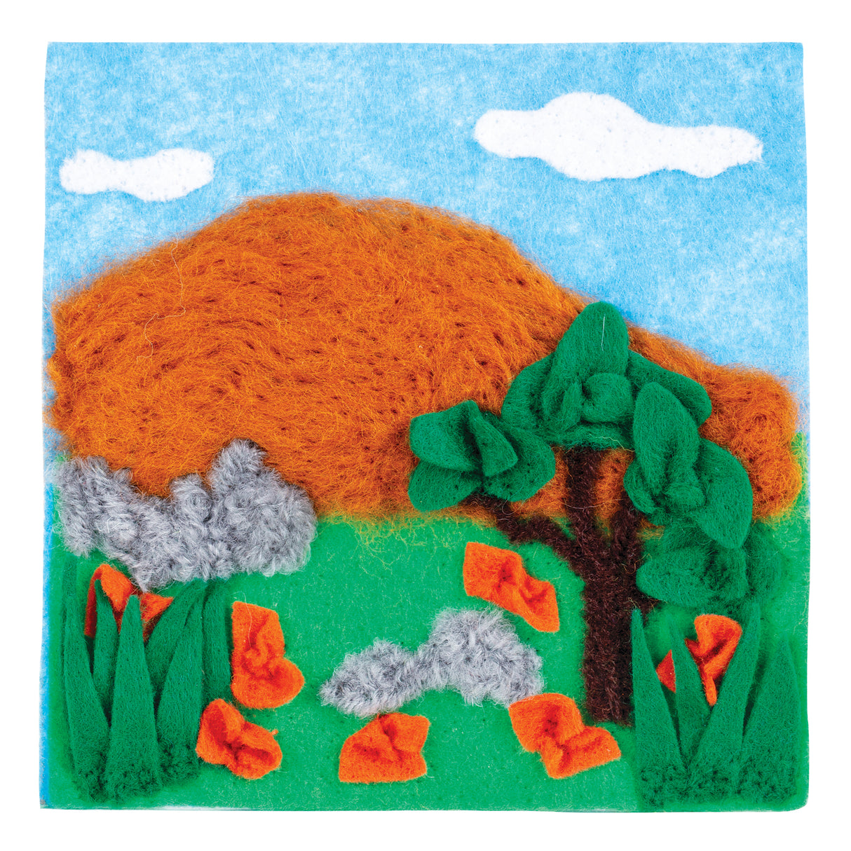 Textured landscape artwork created with coloured wool fibres showing orange hills, green trees, grey rocks, bright orange flowers, and white clouds against a blue sky, demonstrating the creative possibilities of the Dry Felting Kit Set of 10.