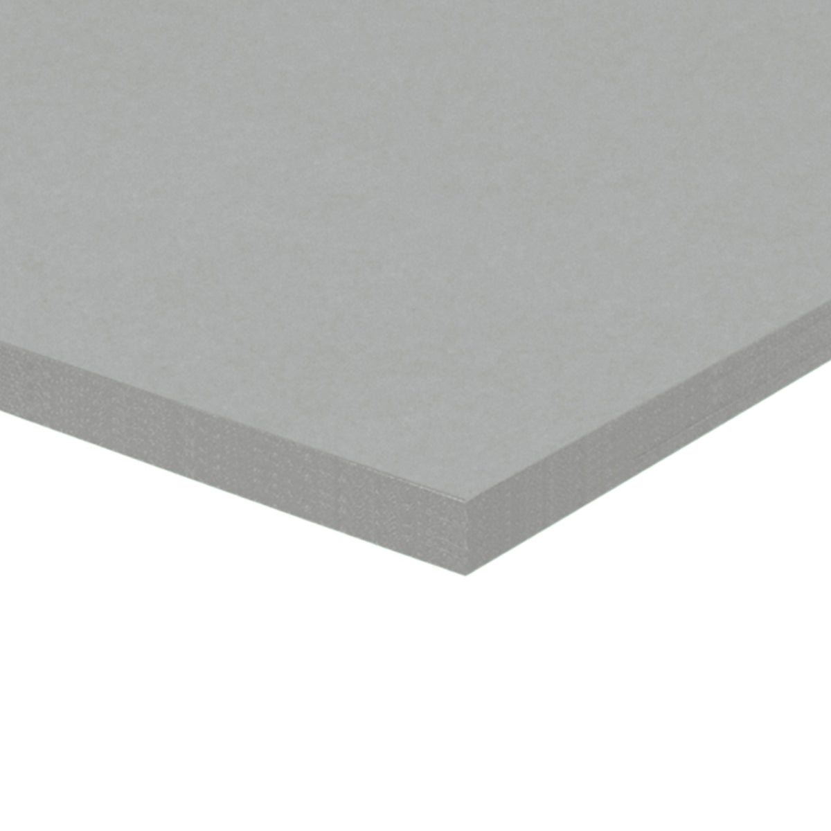 A corner of a stack of grey Zart Cover Paper shown at an angle against a white background. The top sheet has a smooth, even surface, and the layered edge reveals the depth of the pack with its neatly aligned sheets.