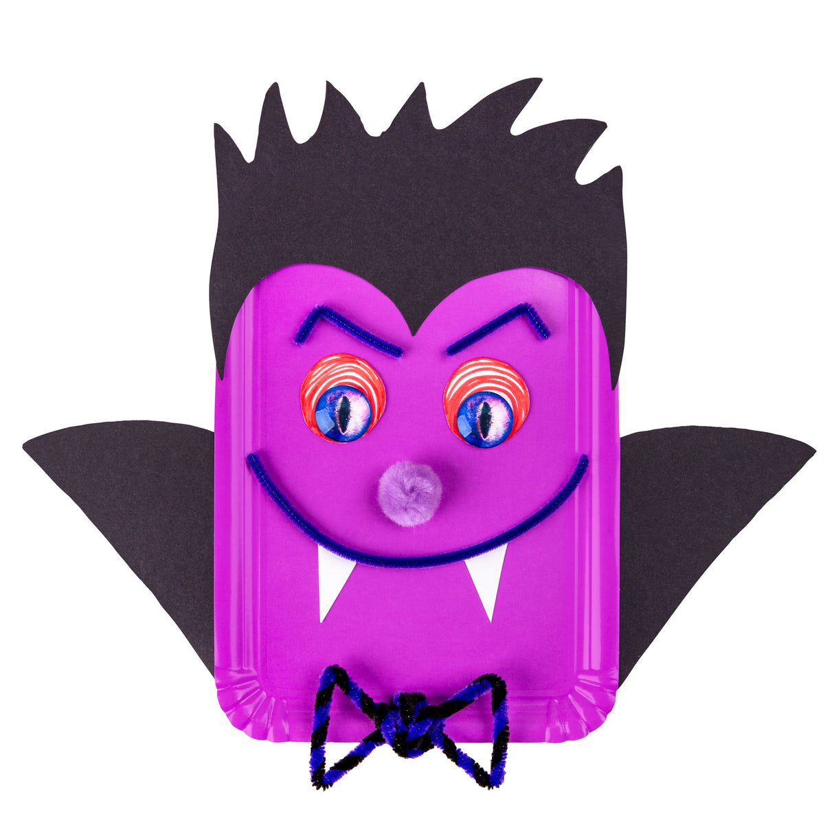 Zart Paper Plates Rectangle transformed into a Dracula bat face, with a magenta plate as the head, black paper spiky hair and bat wings, blue pipe-cleaner eyebrows and smiling mouth, white paper fangs, a lilac pom-pom nose, Joggle Eyes with red swirl detail, and a black-and-blue pipe-cleaner bow tie.