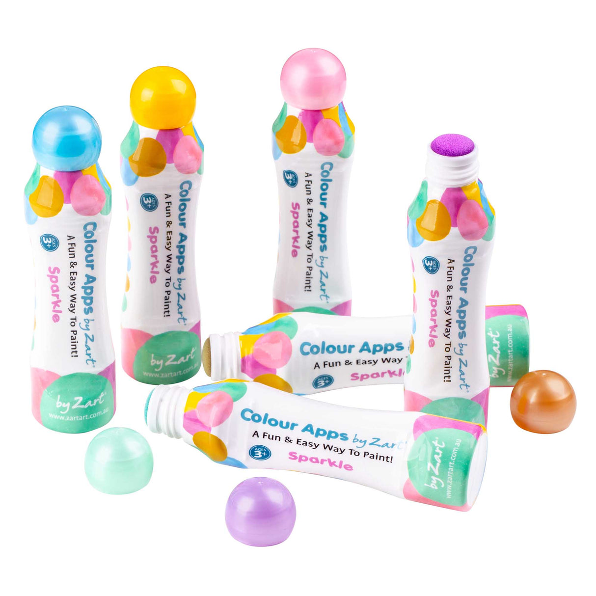 Assorted Zart Colour Apps Sparkle bottles arranged on a white background. Bottles stand and lie flat, showing pastel-coloured caps, patterned labels and loose caps revealing sponge applicators.