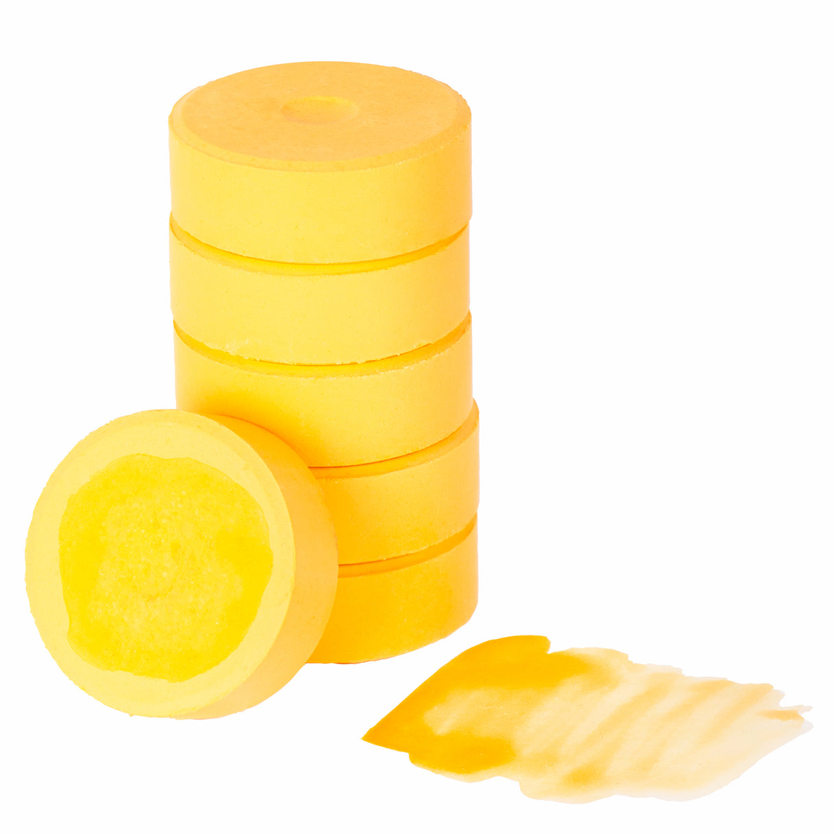Poster Colours Paint Refills by Zart in Peach. Six round disc-shaped paint refills stacked in a tower, with one disc leaning against the front showing the textured paint surface. A small paint swatch in pale peach-yellow sits beside the stack. Against a white background.