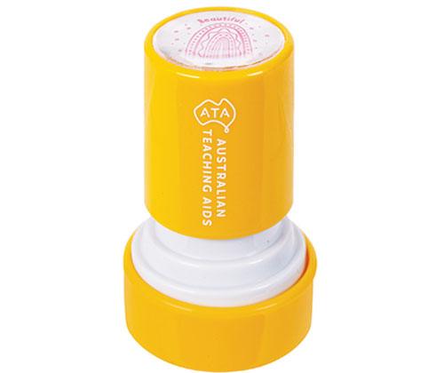 Country Connections Stamps featuring a bright yellow cylindrical stamp with ATA Australian Teaching Aids branding. The stamp displays a purple rainbow design on its circular top surface with the word Beautiful visible. The stamp base separates to reveal a clear cushioned interior pad.