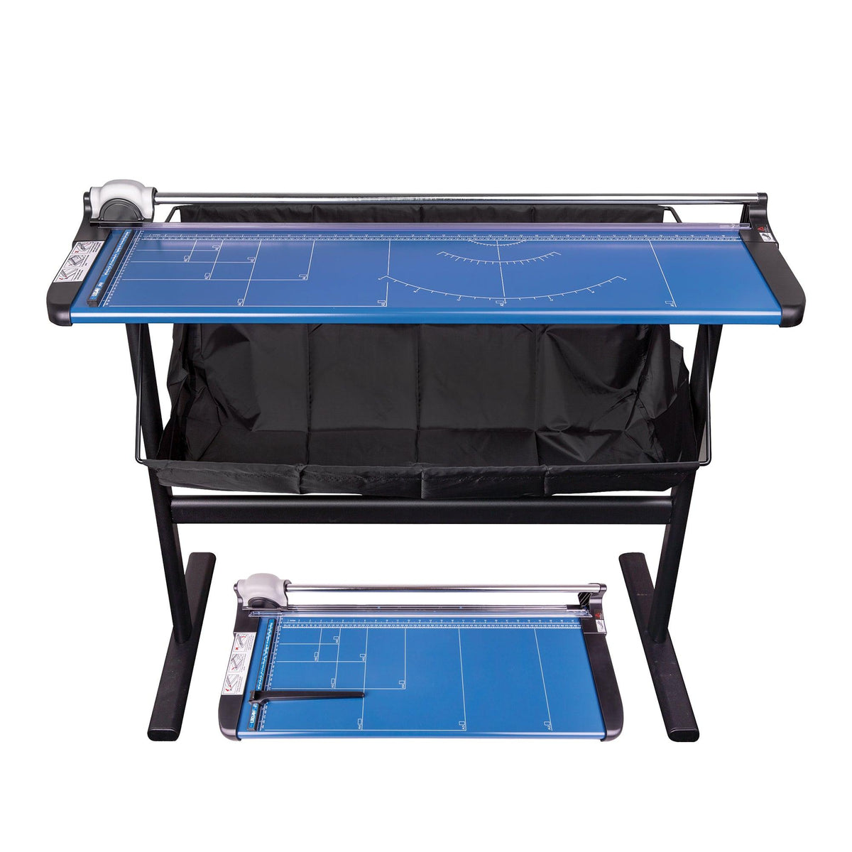 Ledah Professional Paper Trimmer with blue cutting mat featuring white measurement markings and grid lines, mounted on black metal stand with storage shelf beneath. Includes sliding rotary blade mechanism and protective guard rail. Smaller trimmer shown on lower shelf for size reference.