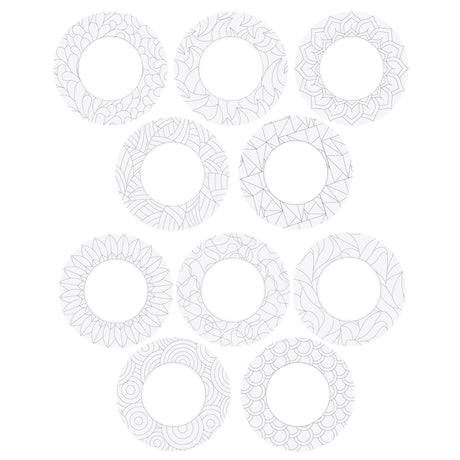 Ten circular Zart ColourMe Wreath shapes in plain white ivory board, each pre-printed with a different black outline pattern — including florals, mandalas, geometric shapes, feathers, scallops and swirling lines. The centre cut-out and blank patterned border show the wreaths ready for colouring.