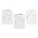 Three plain white Zart Cards and Envelopes Xmas Cut-Outs cards, each three-fold and featuring a different die-cut window shape — a star, a round bauble and a slim finial bauble. The blank cut-out frames sit ready for backing paper or colour to show through.
