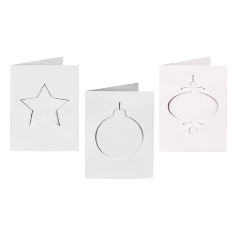 Three plain white Zart Cards and Envelopes Xmas Cut-Outs cards, each three-fold and featuring a different die-cut window shape — a star, a round bauble and a slim finial bauble. The blank cut-out frames sit ready for backing paper or colour to show through.