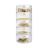 Zart Jewellery Findings Stackable Pack shown as a tower of five clear cylindrical screw-top containers, each filled with gold and silver metal findings. Contents visible through the clear walls include brooch backs, jump rings, shepherd hooks, parrot clasps, and eye pins in mixed silver and gold tones.