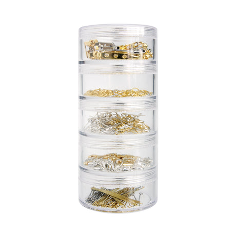 Zart Jewellery Findings Stackable Pack shown as a tower of five clear cylindrical screw-top containers, each filled with gold and silver metal findings. Contents visible through the clear walls include brooch backs, jump rings, shepherd hooks, parrot clasps, and eye pins in mixed silver and gold tones.