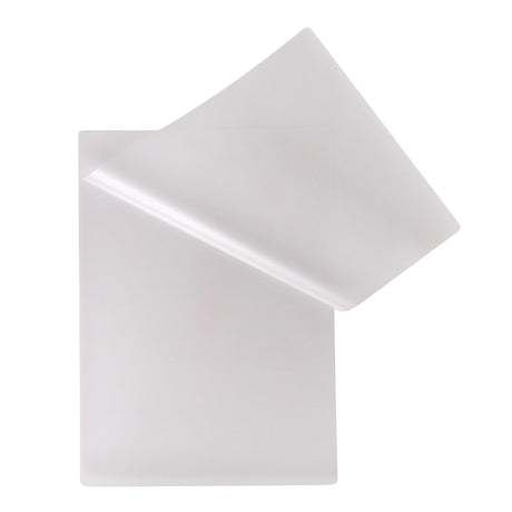 Two translucent Zart Laminating Pouches overlap against a pale grey background. One pouch is partially lifted to reveal the flexible frosted plastic surface, rounded corners, and smooth semi-matte finish. The layered sheets appear lightweight with subtle soft shadows and gentle curved edges.