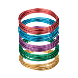 Five coils of Zart Craft Coloured Wire stacked on a white background in red, blue, purple, green, and gold. Each coil is neatly wound and displays a rich metallic finish, showcasing the full range of colours included in the pack.