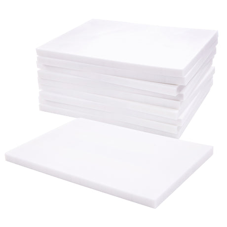 Stack of white soft cut carving blocks arranged in a neat pile, with one block placed flat in front. Each block has straight, clean edges and a smooth matte surface. The uniform thickness is visible along the sides against a white background.