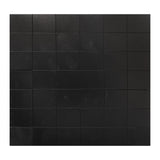 A grid of Zart Adhesive Magnets arranged in evenly spaced rows and columns, filling the frame from edge to edge. Each square is matte black with a faint woodgrain-like texture, separated by thin visible seams between the tiles.