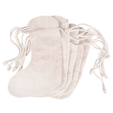 Five Zart Calico Stockings shown fanned out together in natural undyed cotton, each with a rounded heel and toe shape and a drawstring closure at the top. The plain woven fabric and long white cotton drawstring cords are visible across the stack.