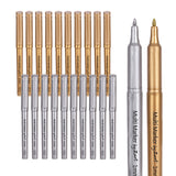 Twenty Multi Marker by Zart pens in metallic gold and silver finishes, arranged with ten capped pens standing upright in the back row and ten uncapped pens in the front, displaying their 1mm fine bullet tips. Two individual markers shown on the right for detail.