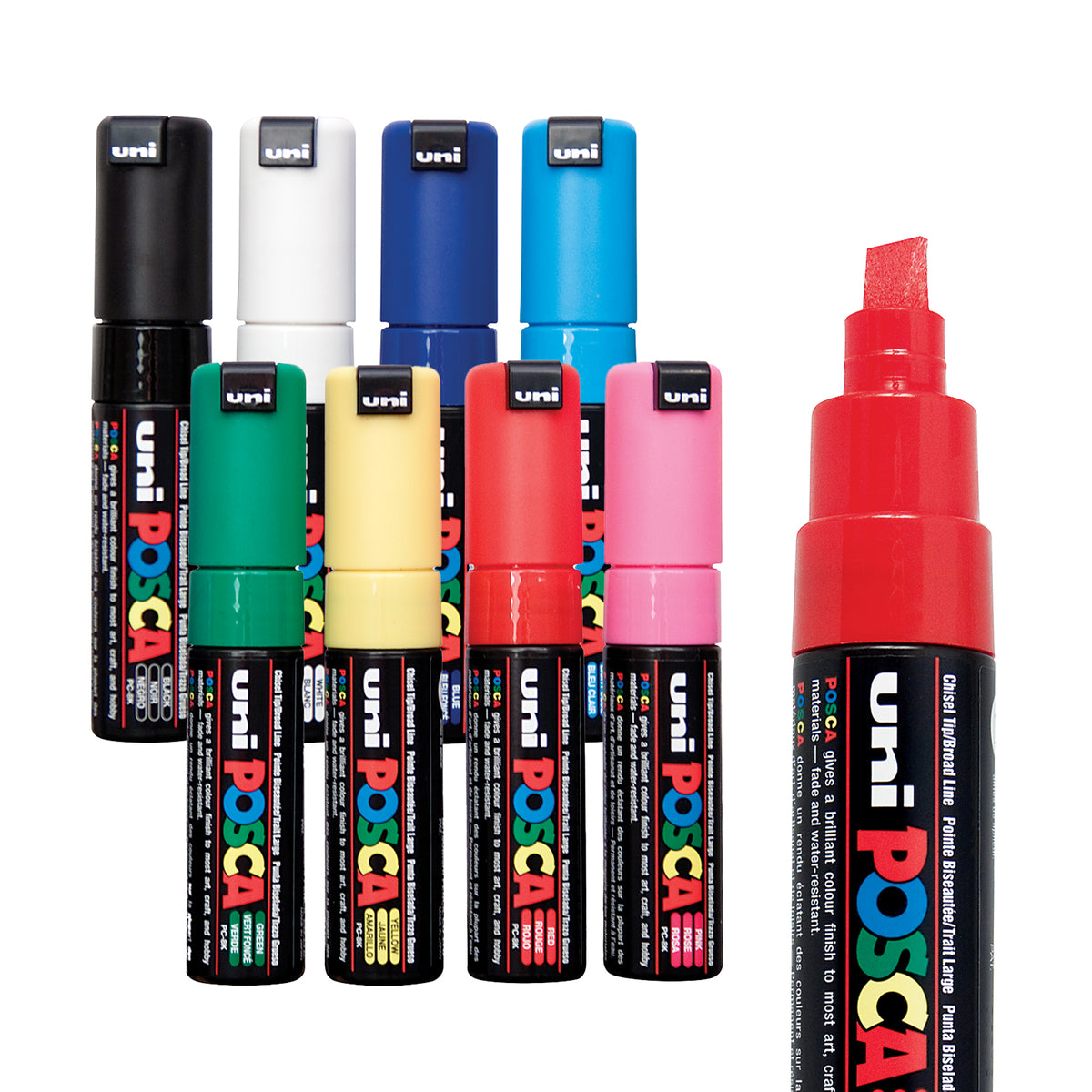 POSCA Chisel Tip Markers set of eight shown standing with caps on, in black, white, navy, sky blue, green, cream, red and pink. A larger uncapped red marker sits to the right, showing its chisel-shaped nib and black barrel with coloured text.