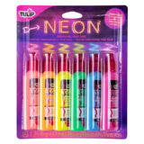 Tulip Slick Neon Dimensional Fabric Paint packaging, a blister pack with six upright bottles in neon pink, orange, yellow, green, blue and poppin’ purple, each with a red pointed nozzle cap. The purple and black card backing features a glowing neon-style “NEON” sign graphic and coloured zigzag lines.