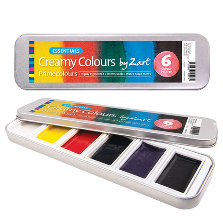 Product image of Creamy Colours Watercolours by Zart Essentials, showing a silver metal tin closed and partially open to reveal six watercolour pans. Packaging displays the product name, brand and “6 Colour Palette”. Colours include white, yellow, red, blue, purple and black.