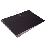 A stack of Zart Scratch Paper sheets in solid black, with a wooden stylus tool resting diagonally across the top sheet. The paper has a smooth, matte black surface, showing no visible texture or markings, ready for scratching designs into the surface.