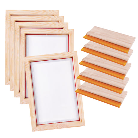 A set of wooden screen printing frames is stacked diagonally, showing pale timber grain and white mesh centres bordered by red edging. Alongside, matching wooden squeegees with smooth handles and bright orange rubber blades are arranged in a neat vertical row.