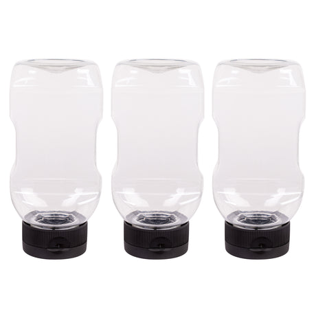 Three empty clear plastic bottles shown upside down on their flat-topped black lids against a white background. The transparent design and wide shape are visible, highlighting their sturdy construction and suitability for controlled dispensing of liquids and art materials.