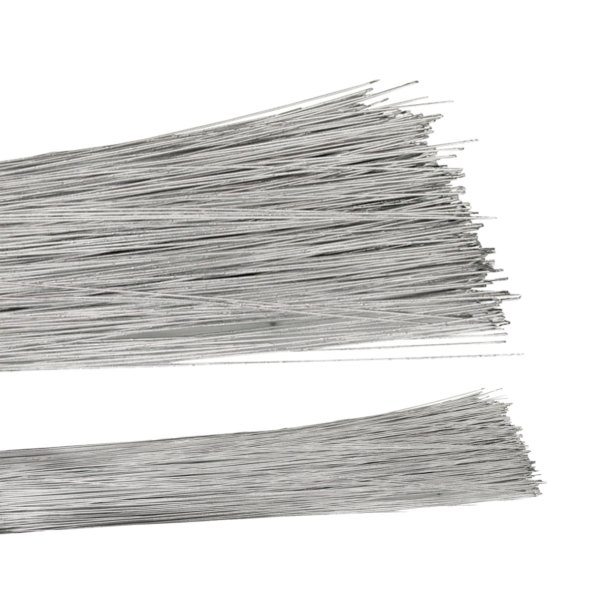 Two bundles of straight silver florist wire laid horizontally against a white background, the fine metallic strands fanning out at the cut ends. The long, slender wires have a bright silvery-grey finish and lie in loose overlapping layers, a few crossing diagonally across the stacks.
